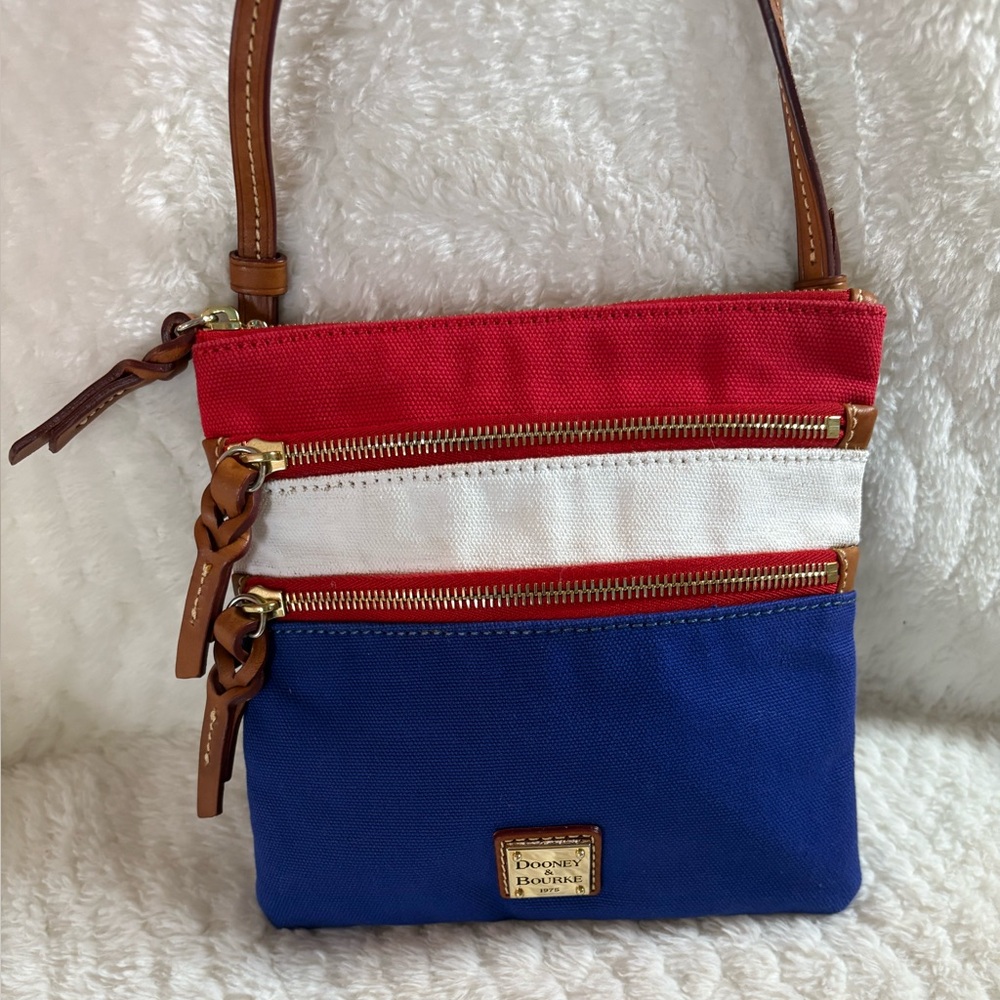 Dooney & Bourke North South Triple Zip crossbody canvas red, white, and blue